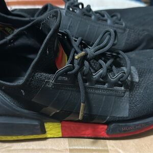 Adidas NMD Men's Black Sneakers with Red and Yellow Accents